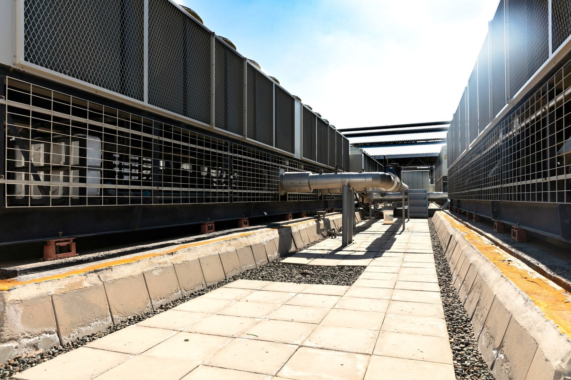 Large industrial cooling system with metal pipes and grids outdoors